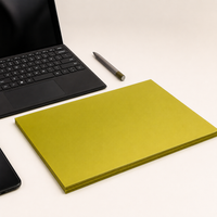Avarrix Metallic Gold Vinyl Sticker Paper A4 sheet on a desk beside a laptop and stylus