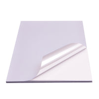 Avarrix Metallic Silver Vinyl Sticker Paper, stack of A4 sheets with top sheet peeling to show adhesive backing